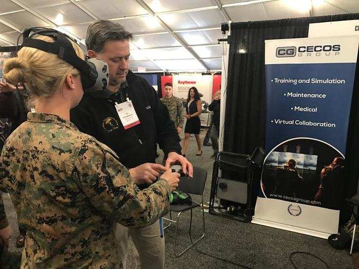 After getting this Marine fitted with the HTC Vive headset, Rob Monroe explained what she was looking at and how she could control things in the virtual world.