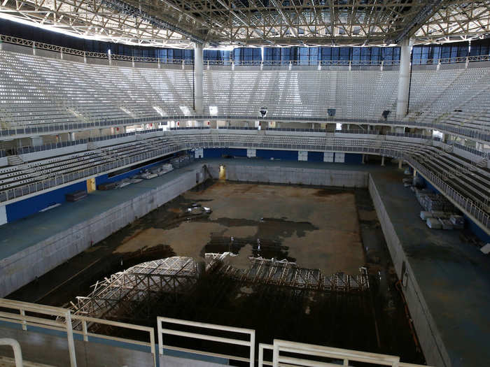 Inside the Aquatic Center, the pool is drained except for some unpleasant standing water.