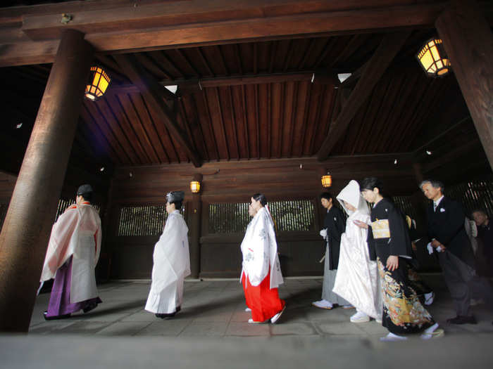 A snow-white kimono is draped around traditional brides in Japan. A matching silk headdress, called a tsunokakushi, hides her "horns of jealousy" and signals her intent to become an obedient wife.