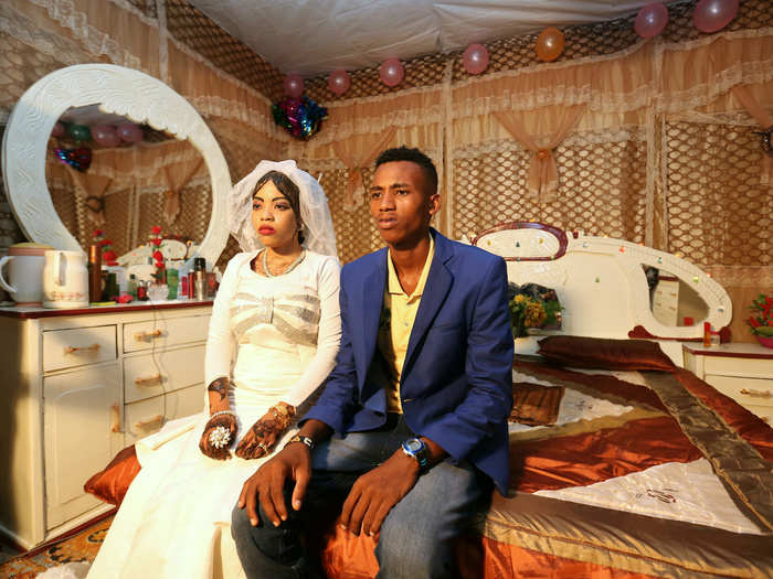 Modern brides in Somalia opt for a Western-style dress and a hijab head scarf, in accordance with Islamic culture. Their hair or hands may be stained with henna.