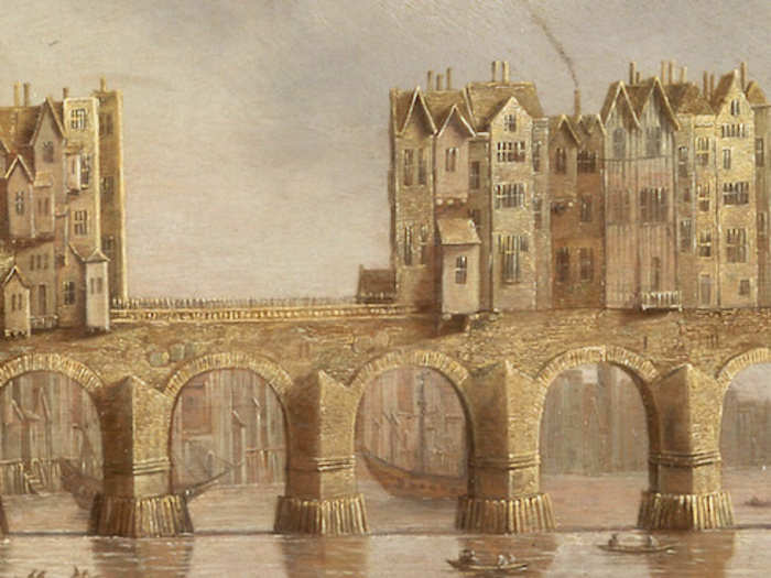 In 1176, King Henry II commissioned a new stone bridge.  Finished in 1284, the original London Bridge would stand for over 600 years. It supported homes and shops — which weighed down its arches over time.