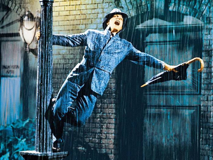 In “Singin’ in the Rain” (1952), arguably the most famous and beloved movie musical, Gene Kelly swings around a lamppost mid-dance ...