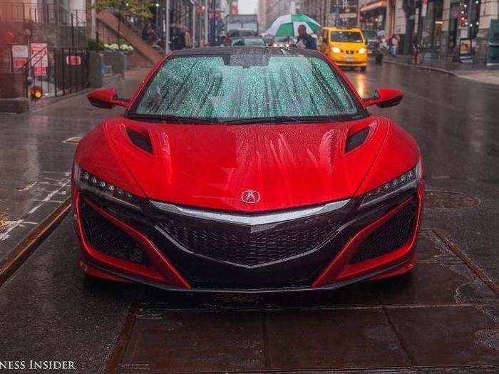 Hollis was fascinated with how rain beaded elegantly on the luminous, deep-red surface of the NSX.