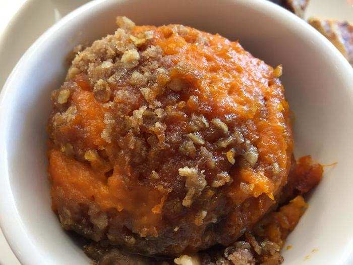 The sweet potato soufflé features a topping of candied pecans.