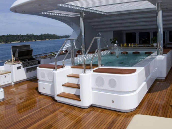 The deck has a swimming bool with a swim-up bar and Jacuzzi. There