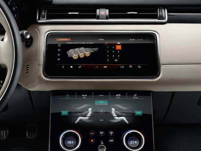 The bottom screen replaces the HVAC and traction management systems.