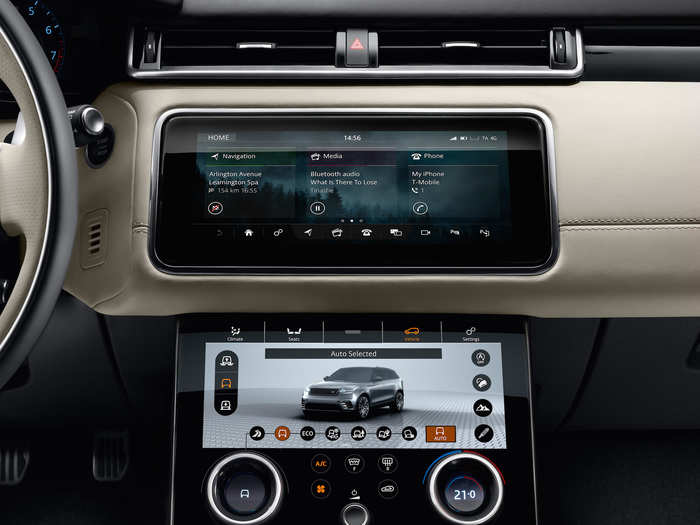 The top screen functions like a traditional infotainment unit while, ...