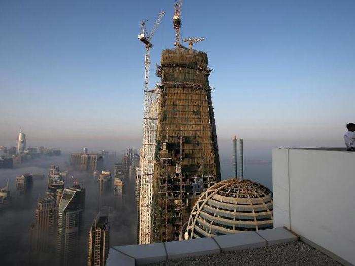 Many of the skyscrapers have been built by migrant workers from India.