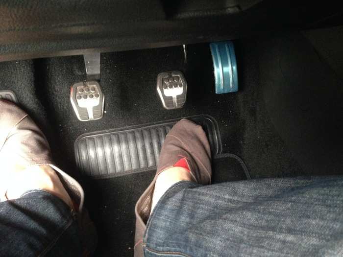 Three pedals on the floor. The clutch is very crisp and sensitive, ready to do your bidding once you get the hang of it.