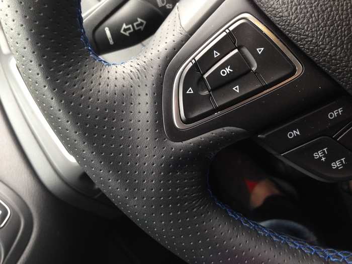 The perforated leather-wrapped steering wheel, with its sporty blue contrast stitching, is superb. The steering itself is precise and responsive. It inspires a lot of confidence.