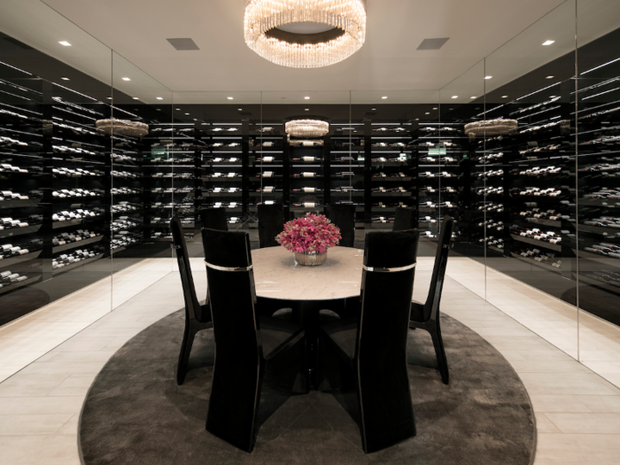 The lavish "wine dining room" has 944 bottles on display as well as Roberto Cavalli flooring, which runs throughout the house.