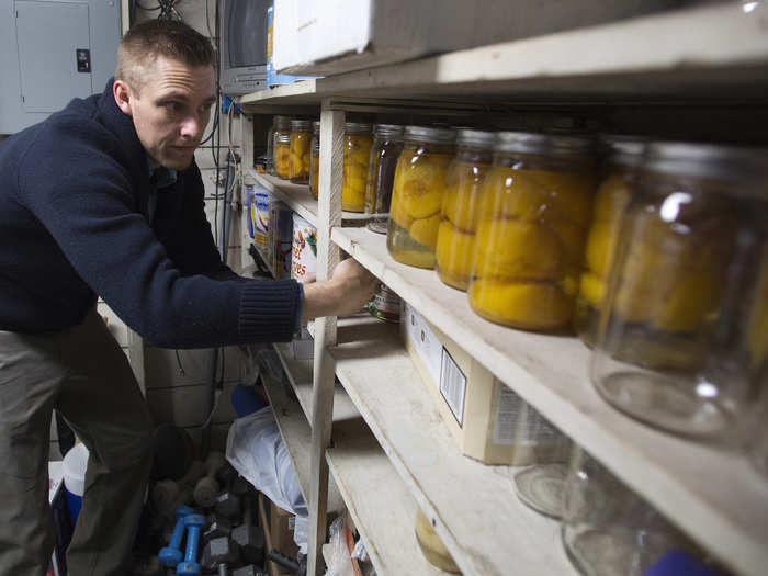 Hugh Vail, an entrepreneur and co-owner of the American Preppers Network, keeps a meticulous inventory of his food storage at his family