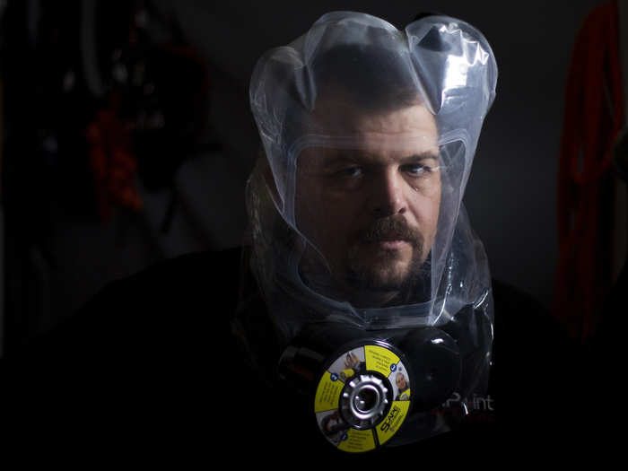 Burns — seen sporting an air purifying mask — is also co-owner and chief technology officer of The American Preppers Network, a national organization that promotes self-reliance.