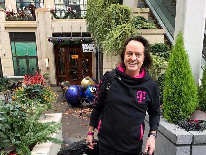 Legere is often on the road, but he makes sure to bring all his T-Mobile gear with him. Here he is holding his custom pressure cooker, featuring the Legere emoji Twitter made for him last year.