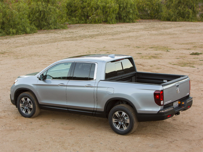 The Ridgeline is also a four-door crew cab, and the bed is about the same size as the Canyon Denali