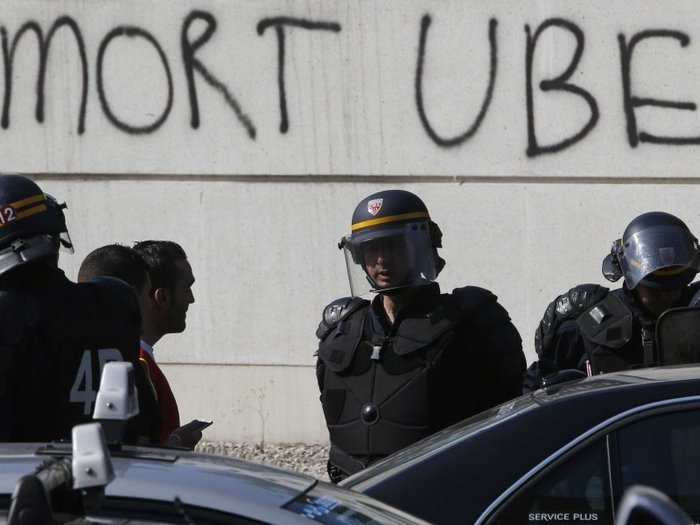 June 2015: Violent protests erupt up across France as taxi drivers and their supporters block roads, burn tires, and attack suspected Uber drivers.