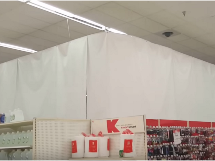 At one store in Hillsboro, Ohio, Kmart hung white sheets to hide the area where the grocery section once was.