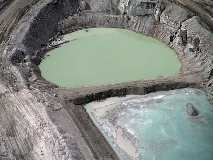 The gravel mine produces its own uniquely colored pools of water.