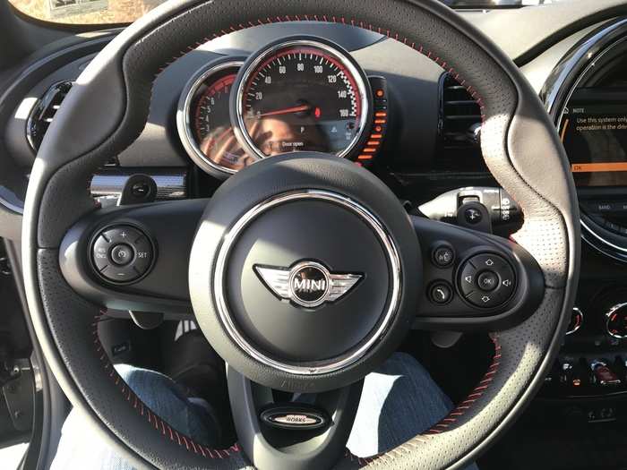 The steering wheel is also leather-wrapped, topstitched in red, and purposeful. It feels good in the hands.