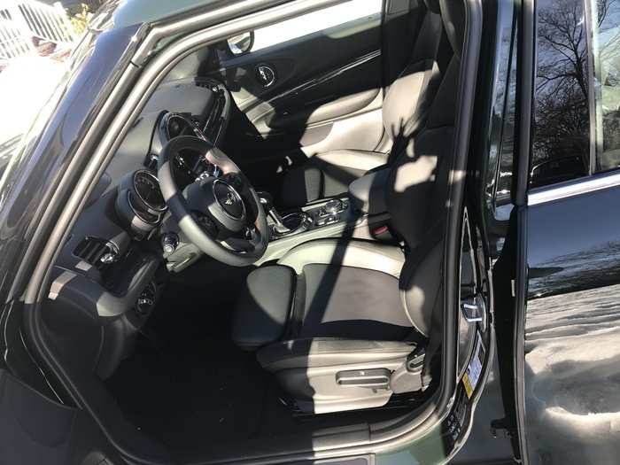 The front seats are snug, well bolstered, and covered in "Carbon Black" leather.