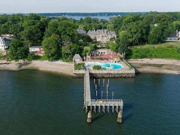 A private pier in the back juts out into the Long Island Sound and can accommodate a  yacht up to 200 feet long.