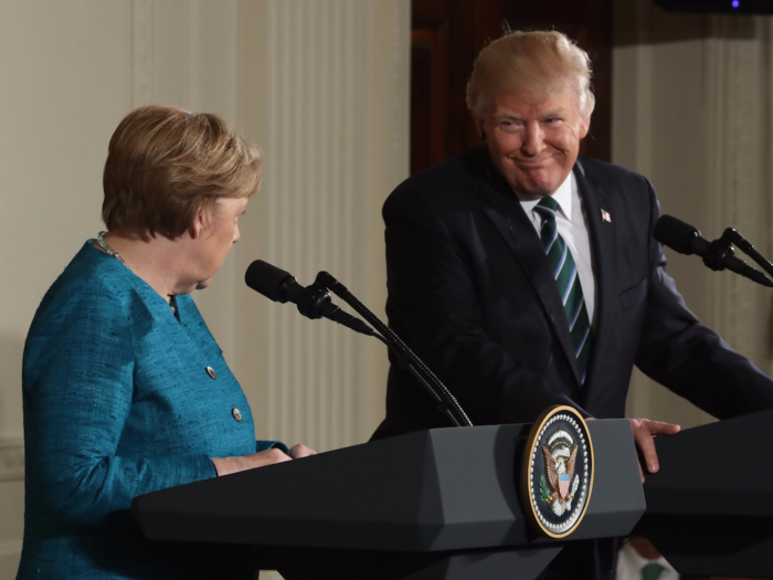 Trump meets with German Chancellor Angela Merkel to discuss NATO. Trump references reports that Merkel was spied on by Obama in 2013, joking he and Merkel "have something in common, perhaps."