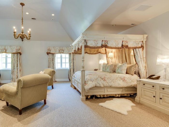 Upstairs is just as grandiose. The master suite has its own fireplace and private wing, which includes an ensuite bathroom, private sitting room, and dressing room.