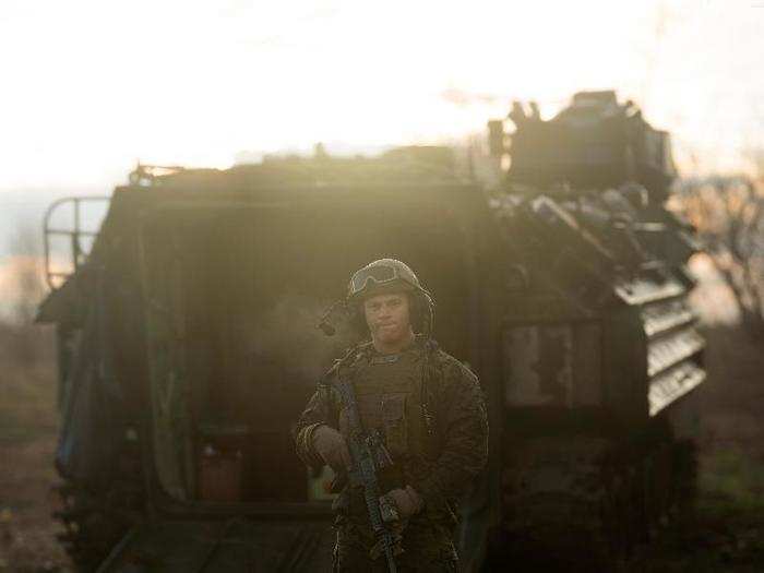 US Marine Lance Cpl. Clayton McCabe, a driver with Amphibious Assault platoon and Missouri native, poses in front one of his AAV.