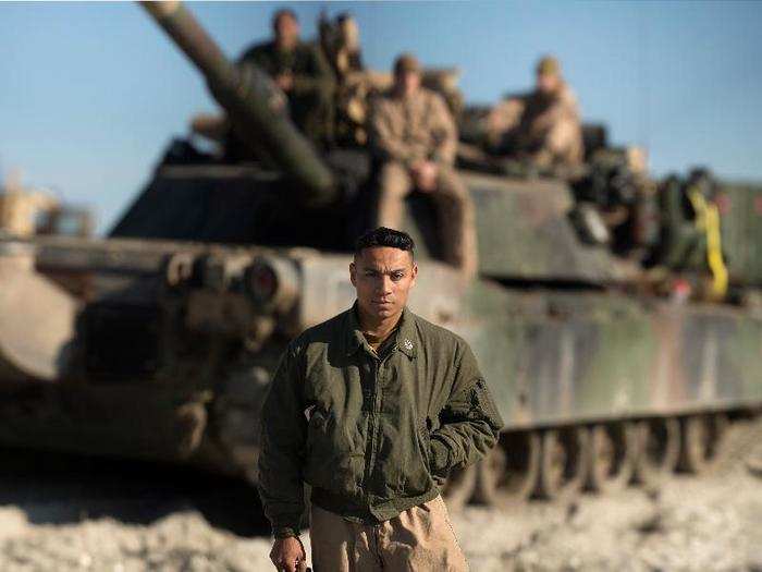 US Marine Gunnery Sgt. Santana Jimenez, platoon sergeant for Tank Platoon and an Arizona native, stands in front one of the Abrams Tank.