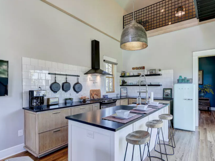 The house has a loft and 20-foot ceilings, which makes the mini kitchen feel spacious.