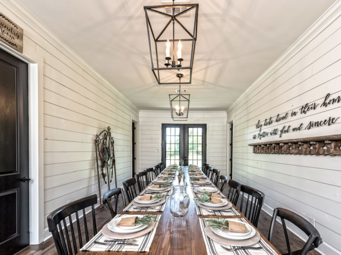 The Gaineses converted a 1,000-square-foot attic apartment, horse stalls, and hay storage into an 2,700-square-foot home. At the center is a rectangular shaped room that has been converted into a dining area and has a large table that seats 20 people.