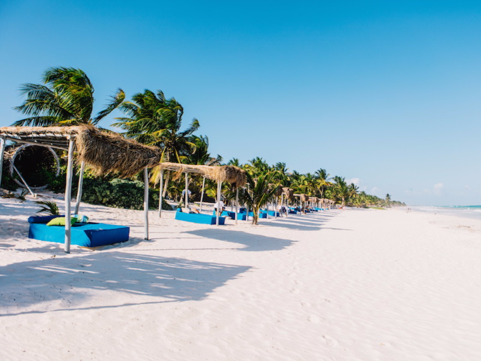 The hotel leads out onto a long stretch of beach.