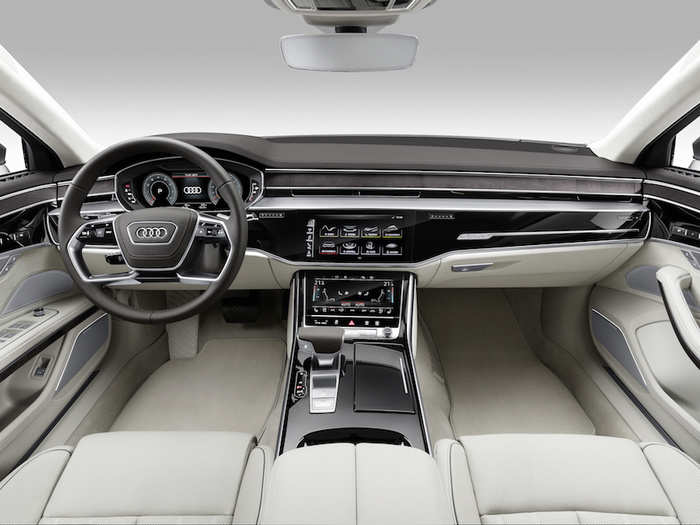 Inside, the sedan features an 10.1-inch touchscreen that blends seamlessly into the black dashboard when it