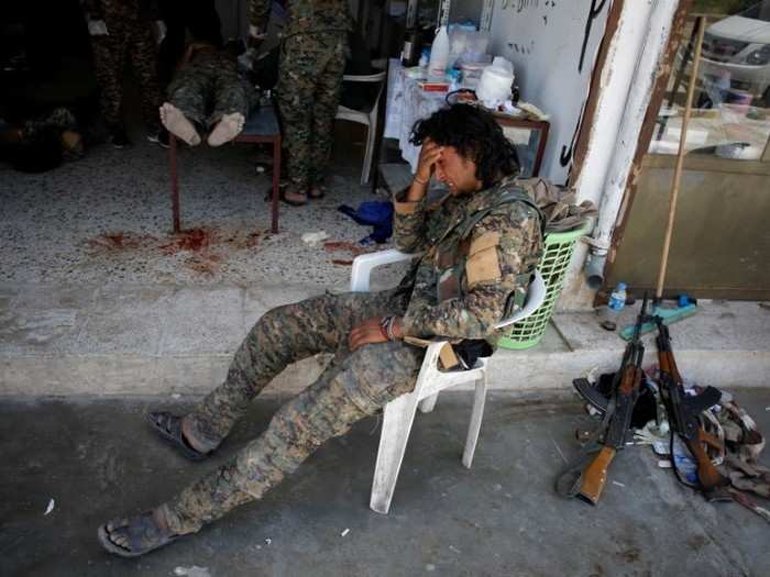 Not to mention those in the fight, like this SDF fighter photographed crying over a fellow soldier being shot and wounded by an ISIS sniper.