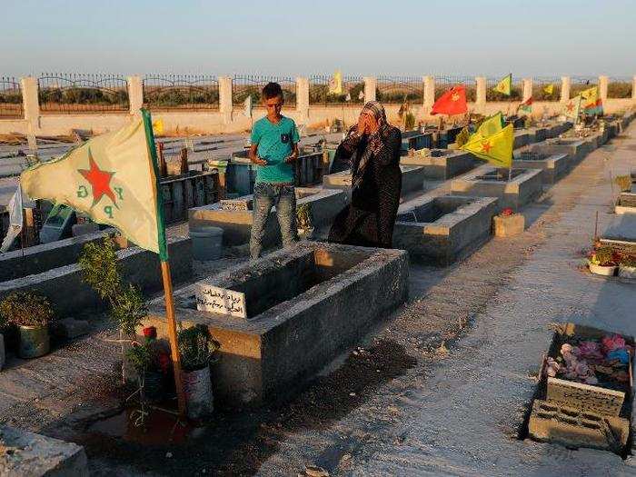 The war has certainly taken its toll on the Kurdish population. Below two Kurds pray over their relative