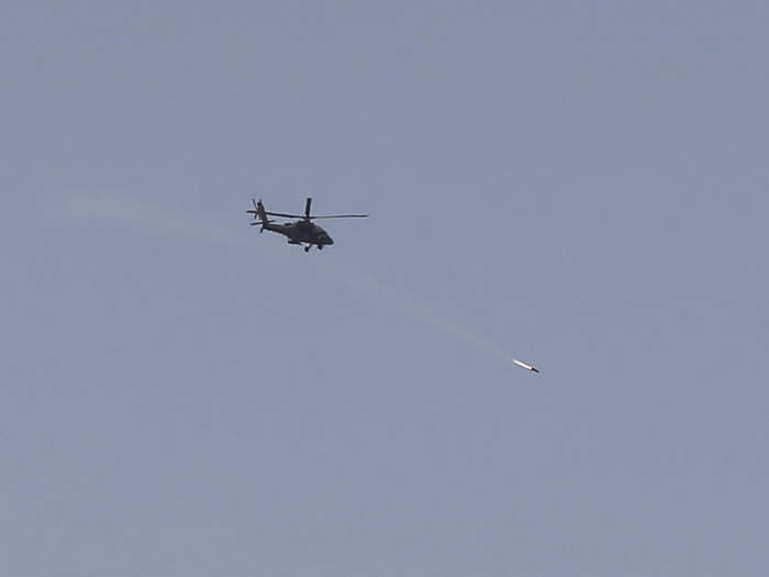 Here is a coalition helicopter firing a missile at ISIS positions.