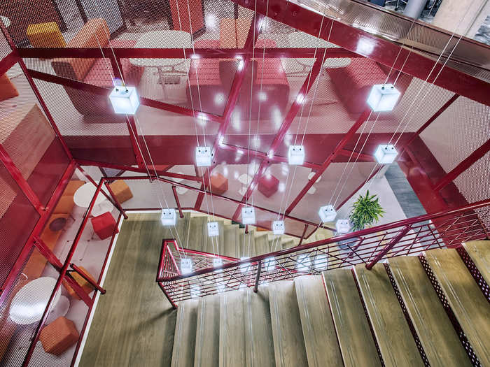 The staircase is lit by over a dozen light cubes fixed to vertical wires.