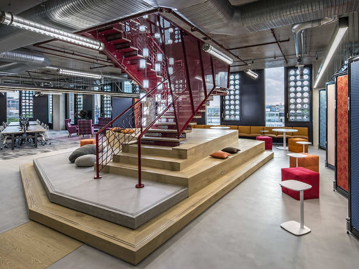 A red staircase connects the 7th and 8th floors.