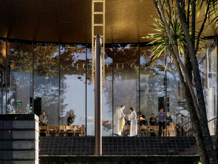 In Auckland, New Zealand, Bishop Selwyn Chapel features a wide overhang with massive glass doors leading to a vaulted interior.