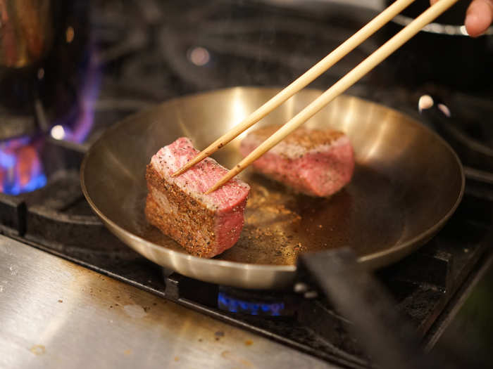 I followed the aroma of meat crackling over open fire to the kitchen, where I found chef and owner Hiroshi Kimura. He arrived at noon in order to prepare for the evening