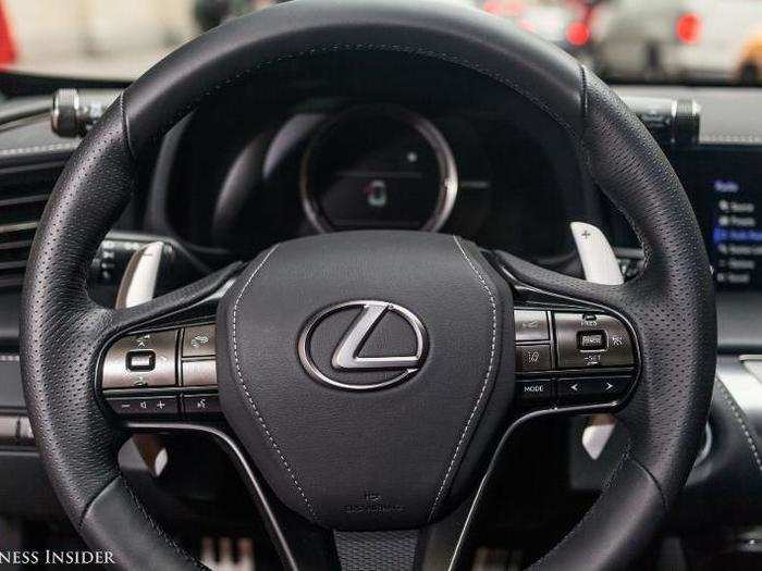 This steering wheel is fantastic. Leather-wrapped, perforated, and with nice big shifting paddles. As you can see, the overall vibe in here is rich and subdued, with the leather counterpointed by brushed-metal trim.