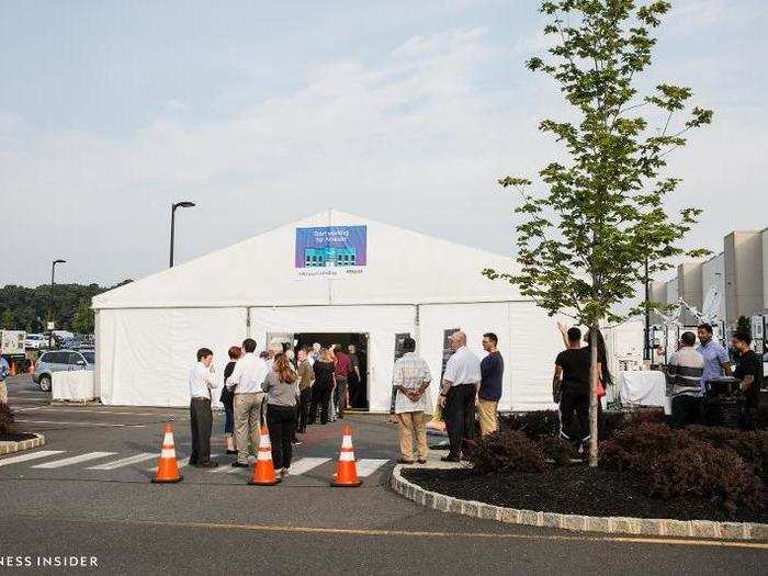 Once candidates made their way to the front of the line, they entered a large, white tent, where they checked in and filled out job applications.