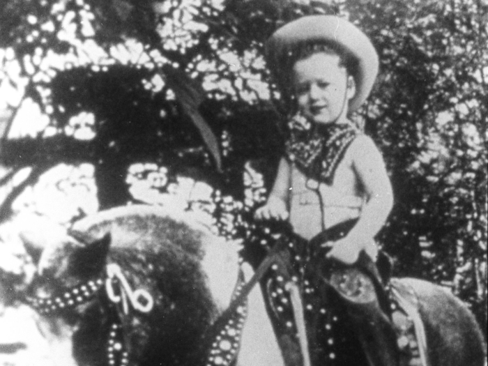 Bill Clinton on a pony near his childhood home in Arkansas.