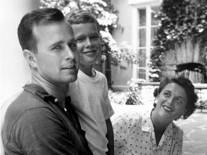 George W. Bush sits between his parents George H. W. Bush and Barbara Bush in Rye, NY, 1955.