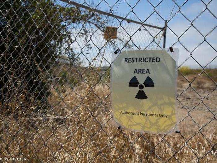 Signs with hazard symbols were posted on fences along the western side of the island.