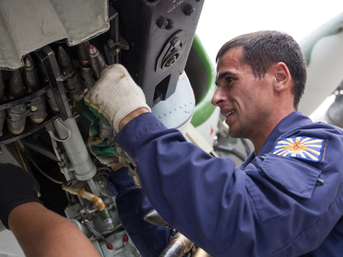 Here is a shot of a Russian mechanic loading the Su-25