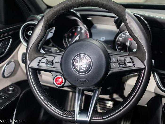 This might be my new favorite steering wheel. It feels just right — not too thick, not too thin. Note the Ferrari-like red stop-start button and the combination of leather, carbon fiber, and brushed metal. Mmm, mmm, good. (It