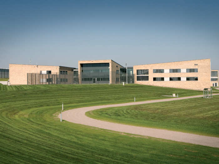 East Jutland State Prison opened a little over 10 years ago in Enner Mark, Denmark. Its clean, simple design masks high security, including infrared cameras, motion sensors, and fingerprint scanners.