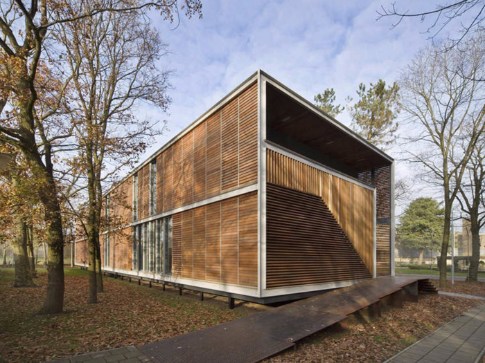 In Overloon, Netherlands, the Juvenile Pavilion youth detention center uses an open design plan and borrows the natural-wood feel of the surrounding environment to keep inmates engaged with the outside world.