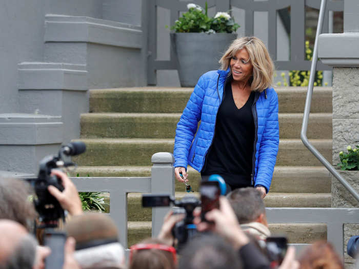 They live together in Le Touquet, a commune near Boulogne-sur-Mer, in the Pas-de-Calais department in northern France. Below, Brigitte speaks with the press outside their home.